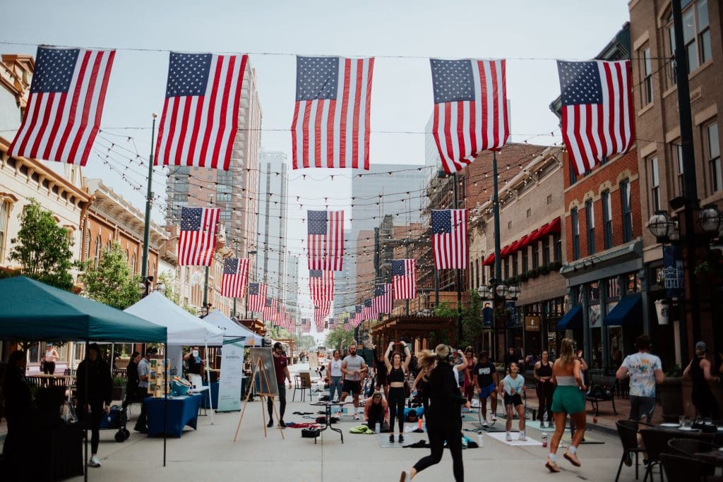 Pedestrian street with flags overhead